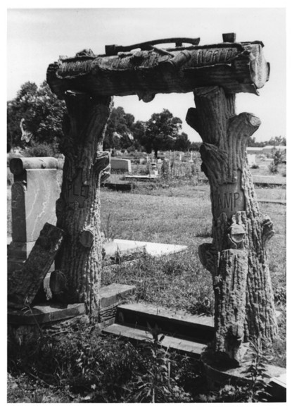 Picture of the monument dedicating the plot of the Woodsmen of the World fraternal organization. Taken in 1984.