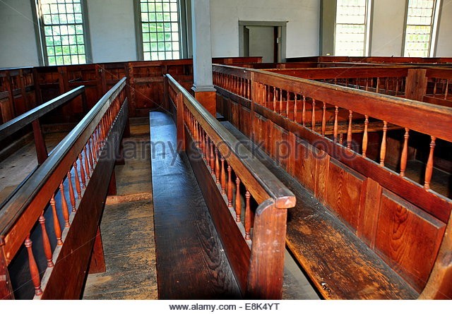 A close up of the pews within the meeting house. 
