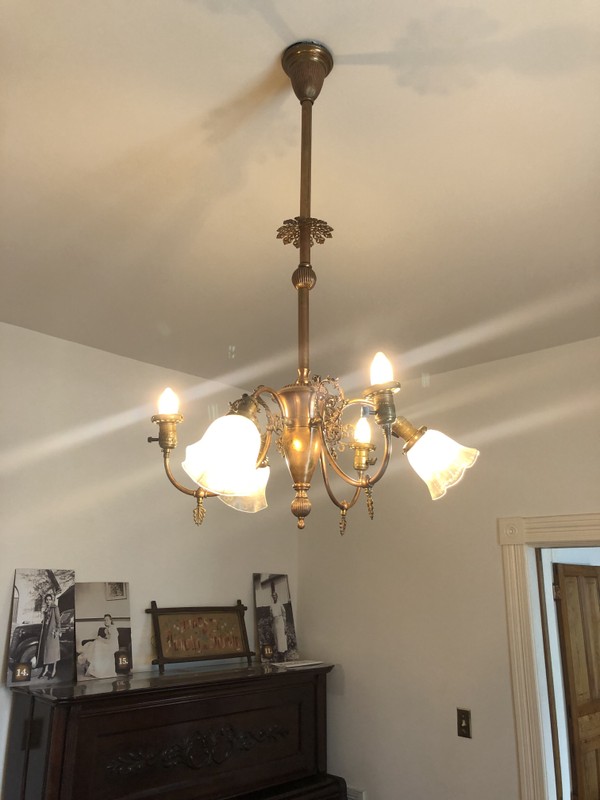 A gas and electric chandelier, purchased by Dr. Pope from Europe. 