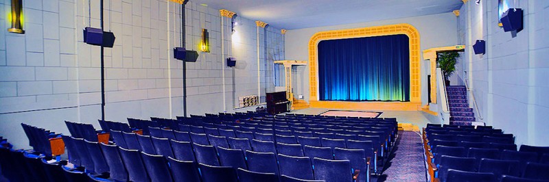 The inside of the theater, with its iconic blue curtain.
