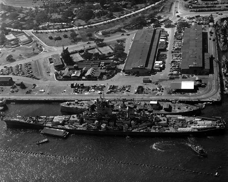 Wisconsin docked in Pearl Harbor on en-route to join the Pacific Fleet in 1944. She is pictured alongside the hulk of the USS Oklahoma, which was destroyed in the Japanese attack in 1941.