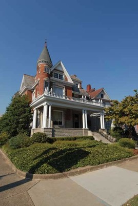 The Ionic columns holding up the house's front porch make it an example of the Free Classic subtype of the Queen Anne style