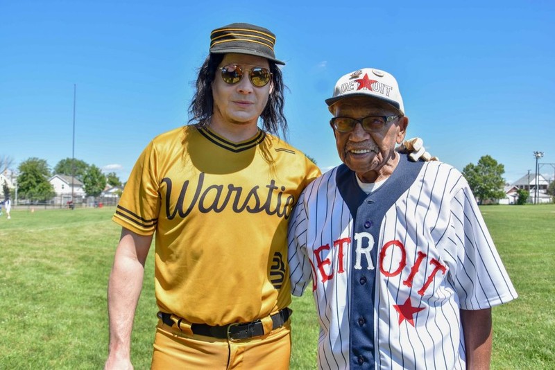 Detroit native and Raconteurs frontman Jack White (left) and 92-year-old former Negro League ballplayer Ron Teasley talk a little baseball before Teasley’s ceremonial first pitch Thursday at historic Hamtramck Stadium.