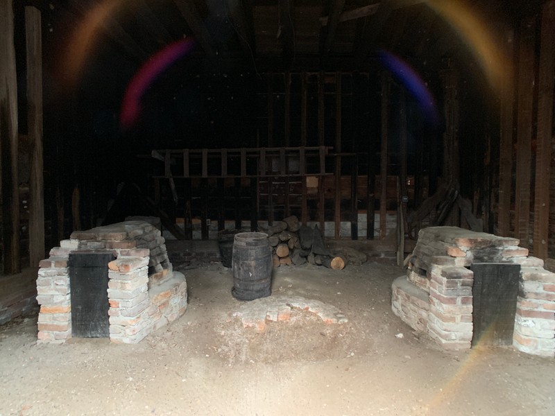 Interior of Smokehouse showing horseshoe hearths