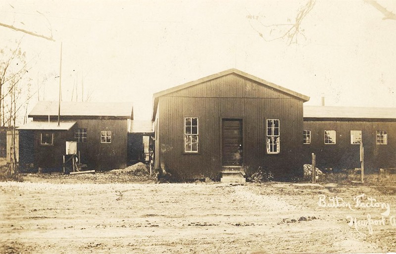 A black and white of an old business building.