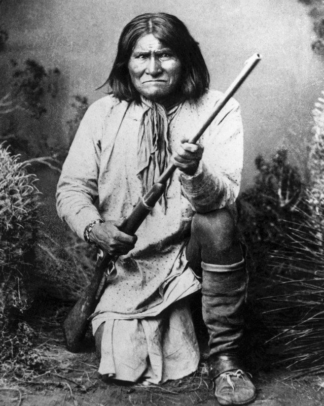 Geronimo, an Apache leader who was fearless in battle, posing with a rifle.