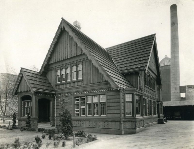 The building features ornate woodwork on the exterior and interior