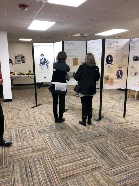 Visitors tour the temporary exhibit Citizens At Last produced by Humanities Texas