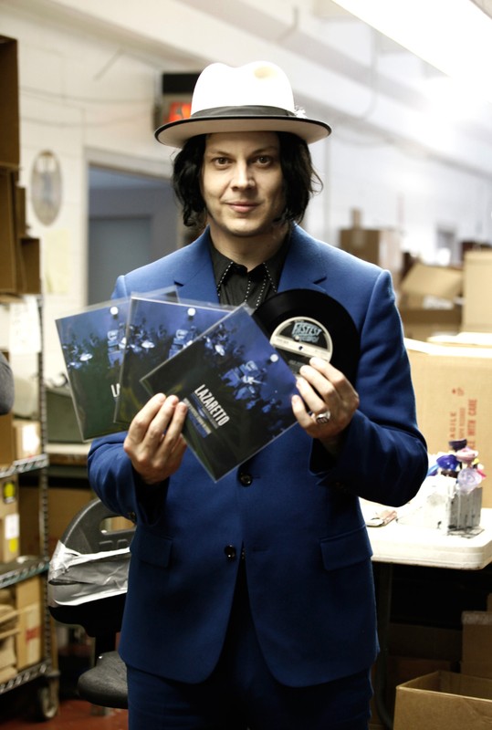 Musician Jack White poses with the world's fastest-made record