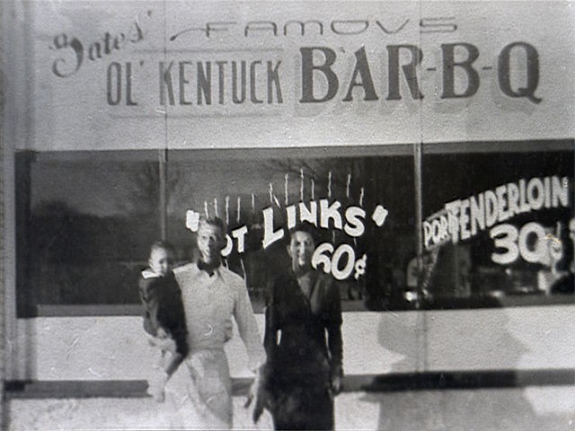 George, Arzelia, and Ollie Gates in front of their restaurant. Ollie continues to run and promote the business.