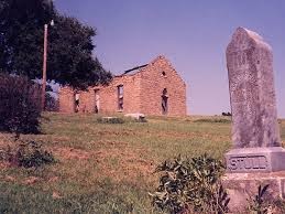 This pictures shows the headstone for the grave of the towns founder Silvester Stull. In the background you can see the ruins of the old church before it was torn down in 2002. This photo, along with many others, portrays the graveyard as an erie place where hauntings are in no short supply.