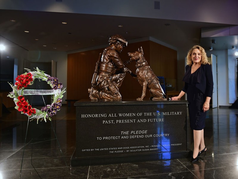 Front side of "The Pledge" monument with sculptor, Susan Bahary