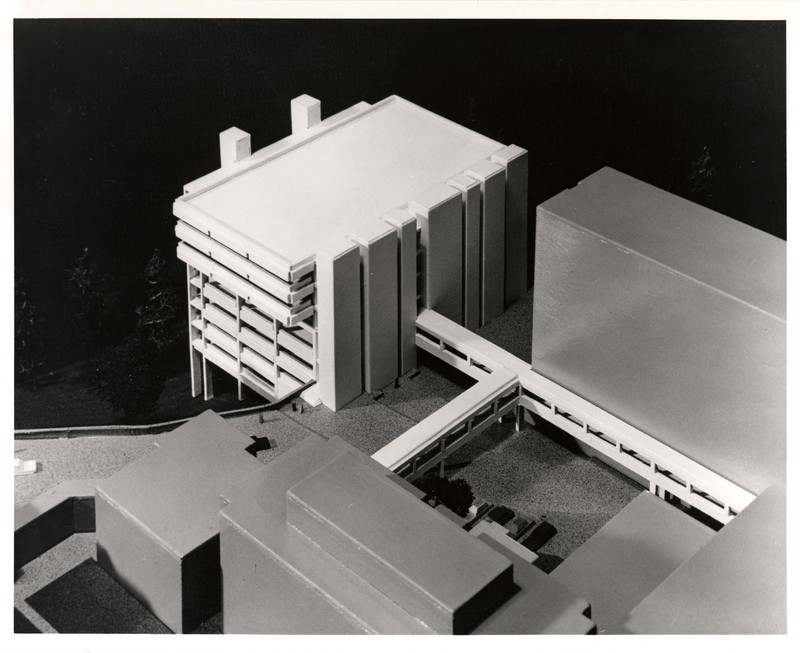 Photograph of an architectural model of the Basic Science Building shows a large Brutalist building connected to several others via pedestrian bridges.