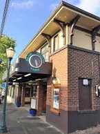 The corner of the building and the Blue Mouse Time clock