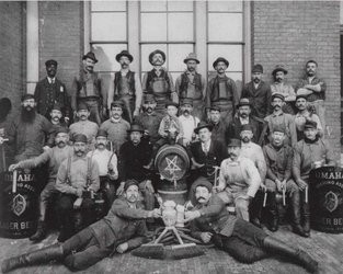 Storz brewery workers are seen posing with the implements of their trade