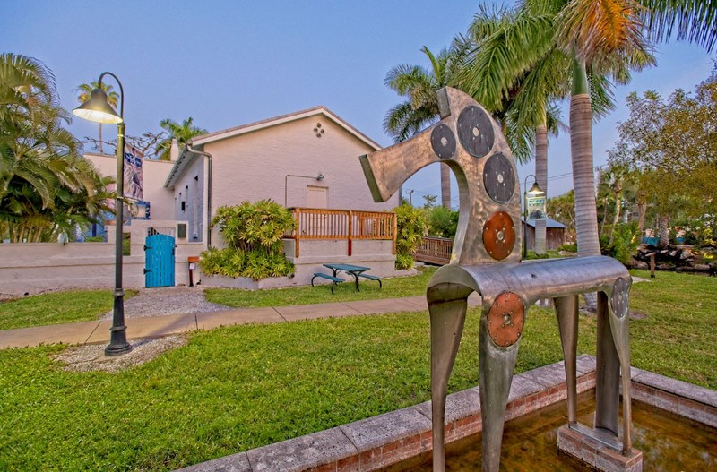 Three fountains are located on the museum property, all of which can be seen from this photo. The featured fountain is known as the horse fountain commissioned by Robert Sailors. There is also a mosaic fountain and a pond fountain all installed on the property when Robert Sailors, a famous weaver, lived on the property.