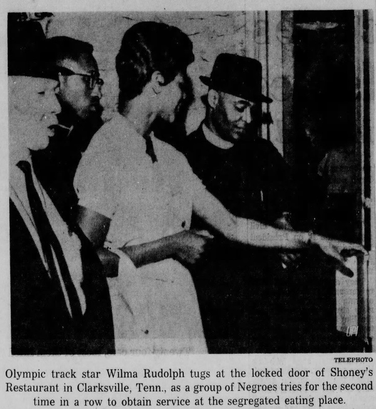 Wilma Rudolph and members of the Citizens Committee try to open the restaurant's locked doors on the second night of their demonstration against segregation in Clarksville. 
