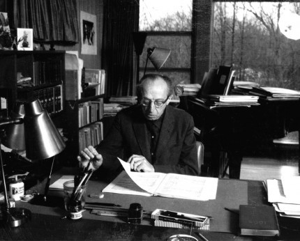 Aaron Copland studying music inside his studio