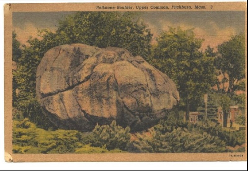 A colored photographic postcard of the Rollstone Boulder. The photograph features a side view of the Rollstone Boulder. 