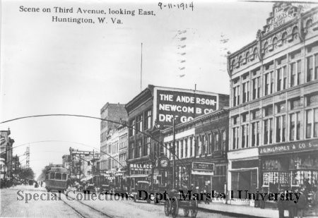 Looking east on Third Avenue, one can see the clock from Seth Thomas Clock Company, which stood outside of C.F. Reuschlein Jewelers