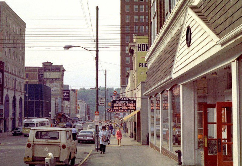 The Caldwell Building, visible in the background with its metal skin in 1973