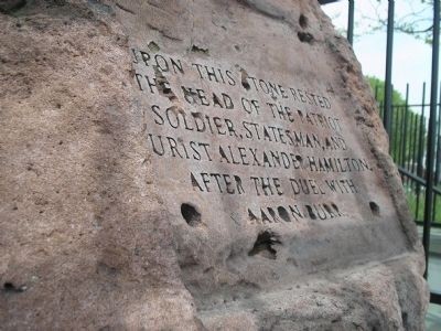 Close-up photograph of the inscription on the rock.