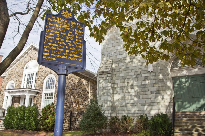 The historical marker of the Woman's Rights Convention of 1852 is located outside the Chester County Historical Society.