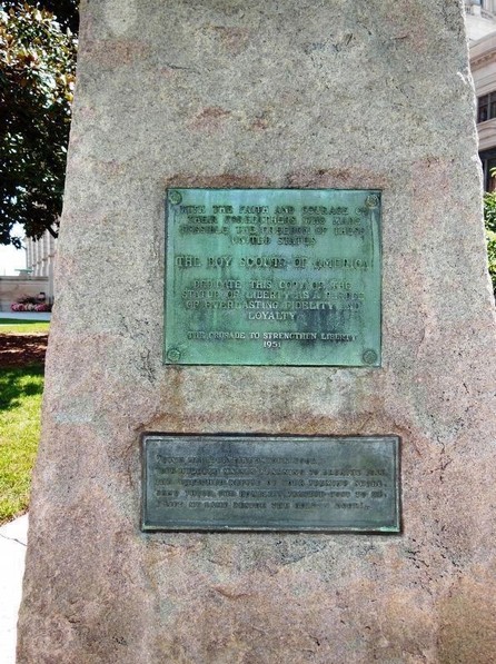 Photograph of the plaque beneath the Statue of Liberty Replica. 