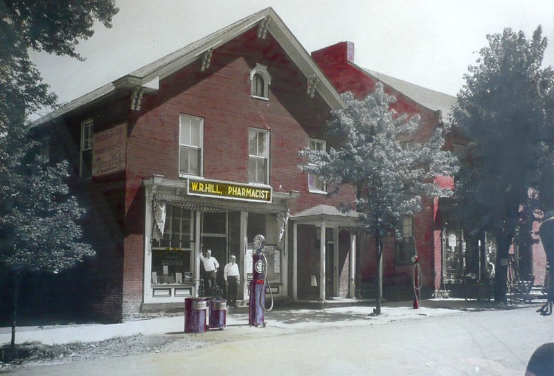 WR Hill Pharmacy in early 1920s. Bernard W. Hill is standing to the left of Walter Reynolds Hill, his father. Collection of BW Hill Insurance Agency.