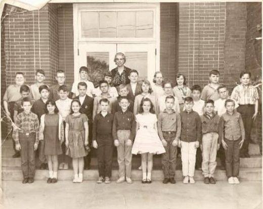 Class photo outside Ensign Elementary, circa 1960s