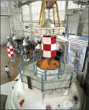 Positioning a drop vehicle on top of the vacuum chamber