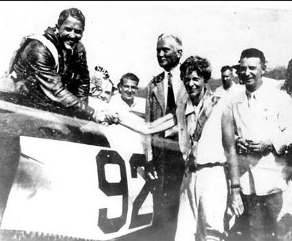 After winning the Bendix Trophy, 1932. - L to R: James Haizlip, Herlam Bingham (the discoverer of Machu Picchu, and at the time a senator) Amelia Earhart, Cliff Henderson, managing director of the National Air Races. Flying the Wedell-Williams '92'.