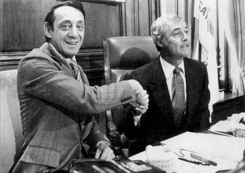 Mayor George Moscone and Supervisor Harvey Milk. Milk was the first openly gay elected official in the state of California.