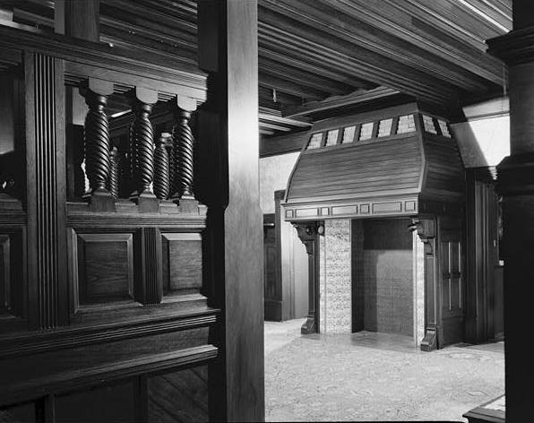The house's large central hall and fireplace.