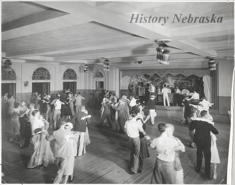 "	Dance room party for the cadets at the Lincoln Airplane and Flying School in Lincoln, Nebraska. Performing on stage is Leo J. Beck and his orchestra," c.1940