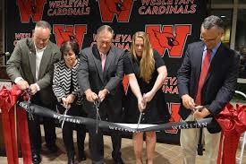 Bill Belichick cutting the ribbon at the ceremony where Belichick Plaza was introduced
