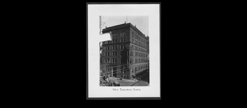 1928 photo of the New England Building. Notice the cable car wires. 