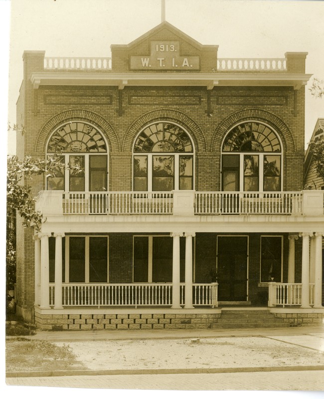 Headquarters of the St. Petersburg Women’s Town Improvement Association in downtown St. Petersburg, circa 1913. This building no longer exists. The WTIA was founded in 1901 and first met in the Detroit Hotel. Sarah Armistead, the widow of John C. Williams, was an early member of the WTIA. The WTIA continued the work of the Park Improvement Association, who were responsible for building the bandstand, in beautifying Williams Park. 