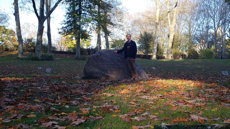 The grove's memorial boulder with a person for scale