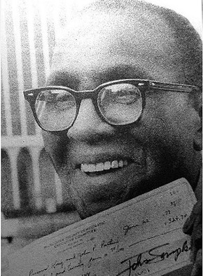 Primus King as he finally receives his settlement from the case against Muscogee County Democratic Party in 1977.  He was awarded $324.70, even if the ordeal cost him thousands of dollars in the end.