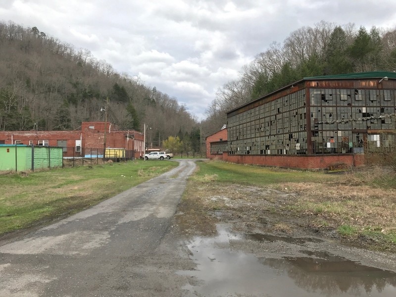 Former site of the big store on the left (demolished), and the machine shop on the right.