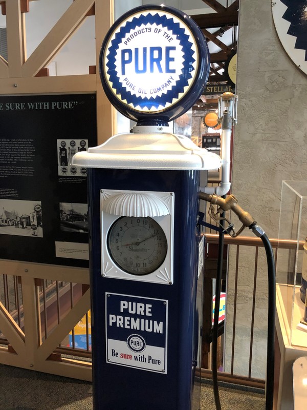 This style of gas pump was used by service stations beginning in 1936. The blue and white colors make it easily recognizable as a Pure pump.