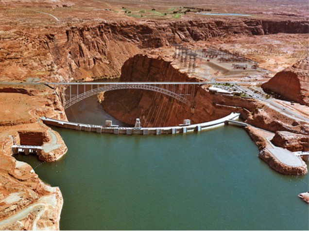 Lake Powell reached full capacity in 1980. It took 17 years to fill and when completed, the elevation was 3,700 feet and the total capacity was 26 million acre-feet. At this time, the water was blue and green on the Lake Powell side, but on the other side it was dark brown. This indicates there is not a lot of water on the other side. It is mixing with the dirt causing the brown color to show.