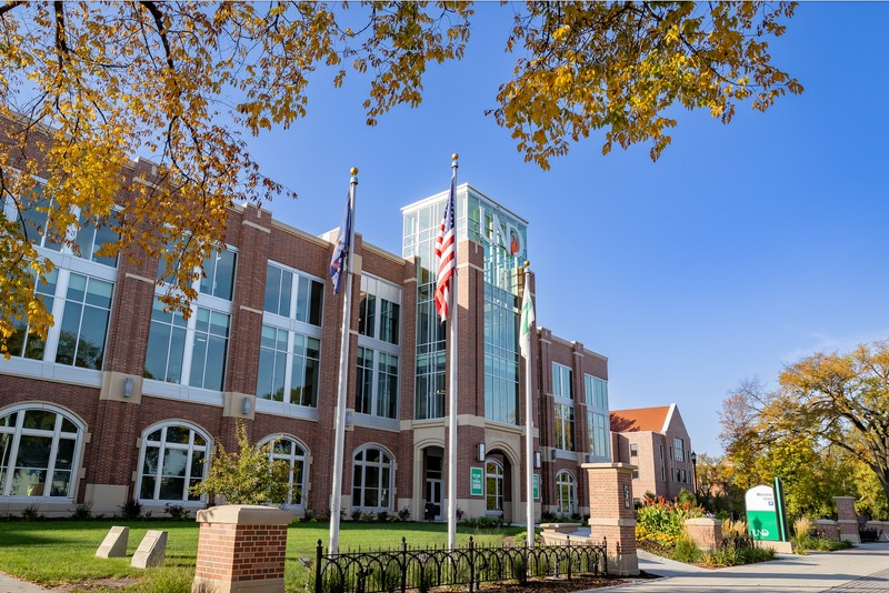 Building with flags of the US and ND in foreground