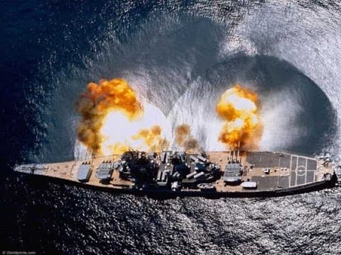 Photo of the USS Missouri firing a full broadside