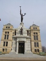 The monument resembles a Greek temple and has been restored and is on the National Register of Historic Places along with the civic building behind it.