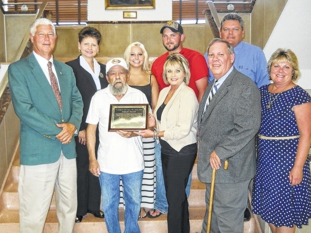 Sculptor Bob Roach being honored in 2013 by the Mason County Commission for his stainless steel art pieces depicting the history of Mason County, WV.