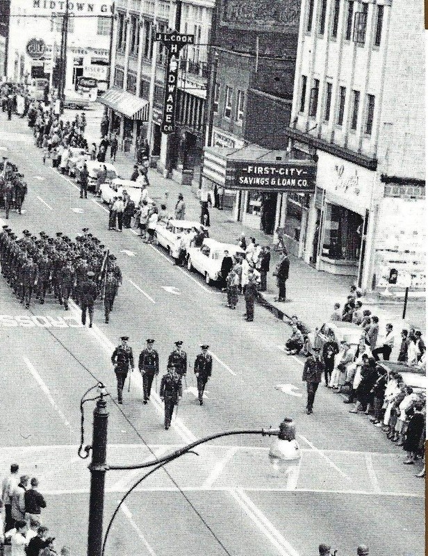 The former theater's marquee was used by First City Savings & Loan, pictured during a 1962 parade