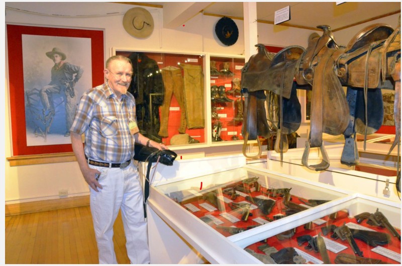  Bill Mackin looks over the vast array of cowboy materials on display at the Museum of Northwest Colorado. A longtime collector of items like guns, spurs and other Western equipment, Mackin donated and later sold his collection to Moffat County and volunteers regularly at the museum. 