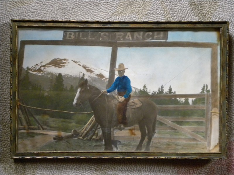 An antique framed photo of Bill Thomas on his horse in front of the Bill's Ranch sign.
